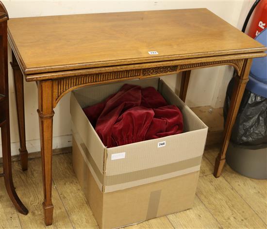 A late Victorian walnut folding card table